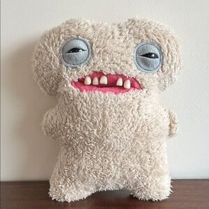 Adorable Tan Stuffed Monster Toy